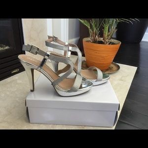 Silver high heel sandals size 10.
